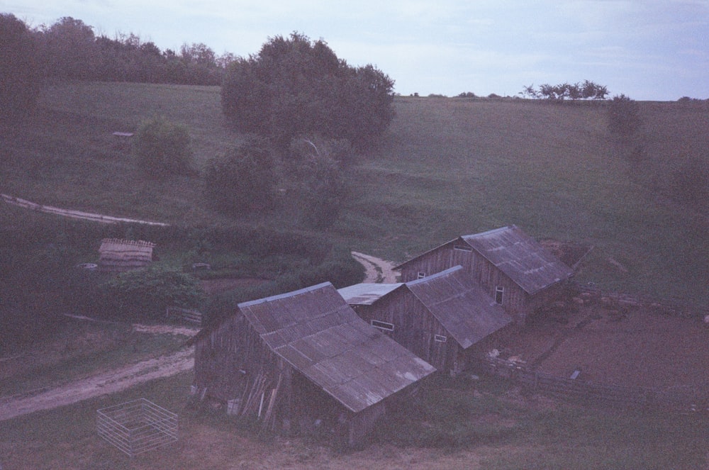 an aerial view of an old barn in the country