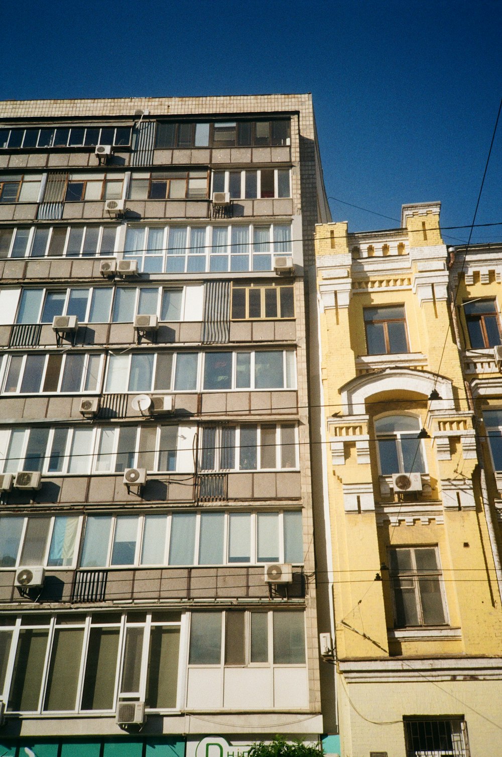 a tall building with lots of windows and balconies