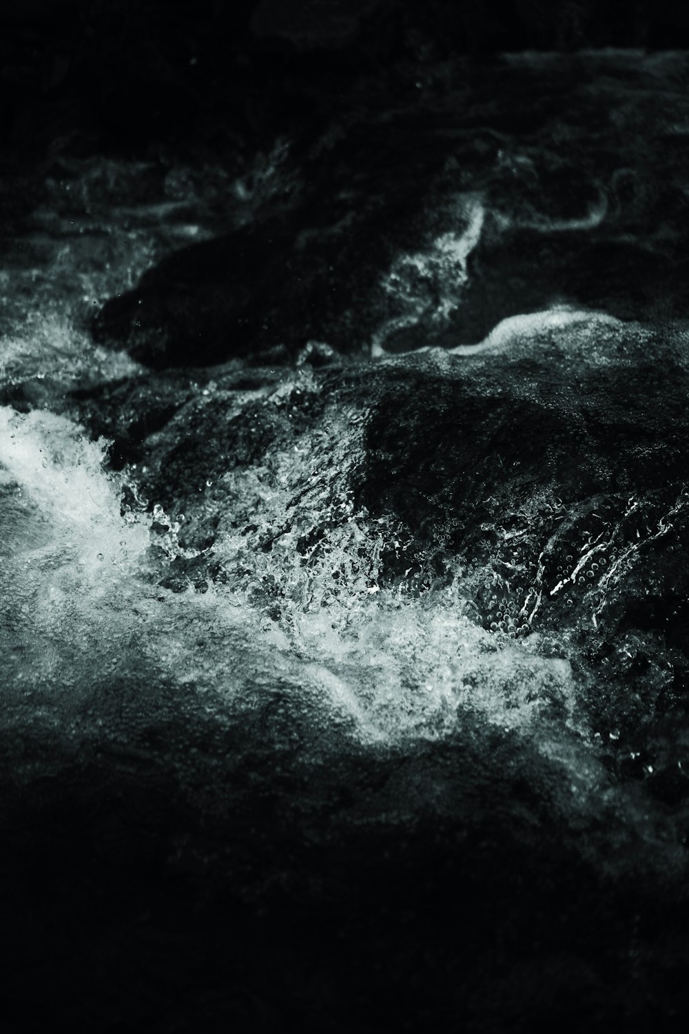 a black and white photo of a river