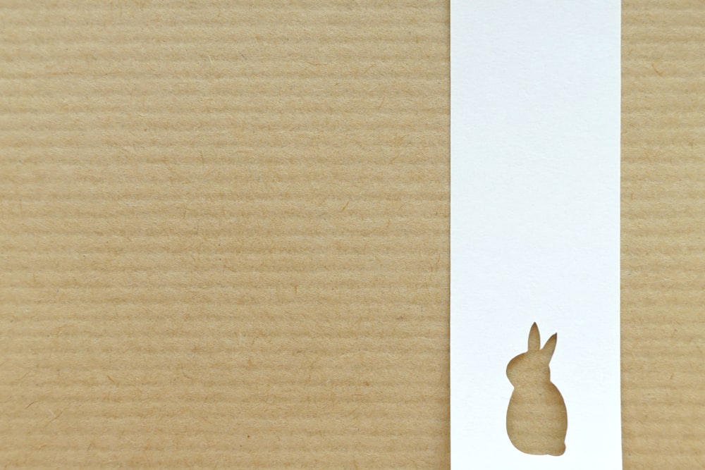 a rabbit cut out of a piece of paper