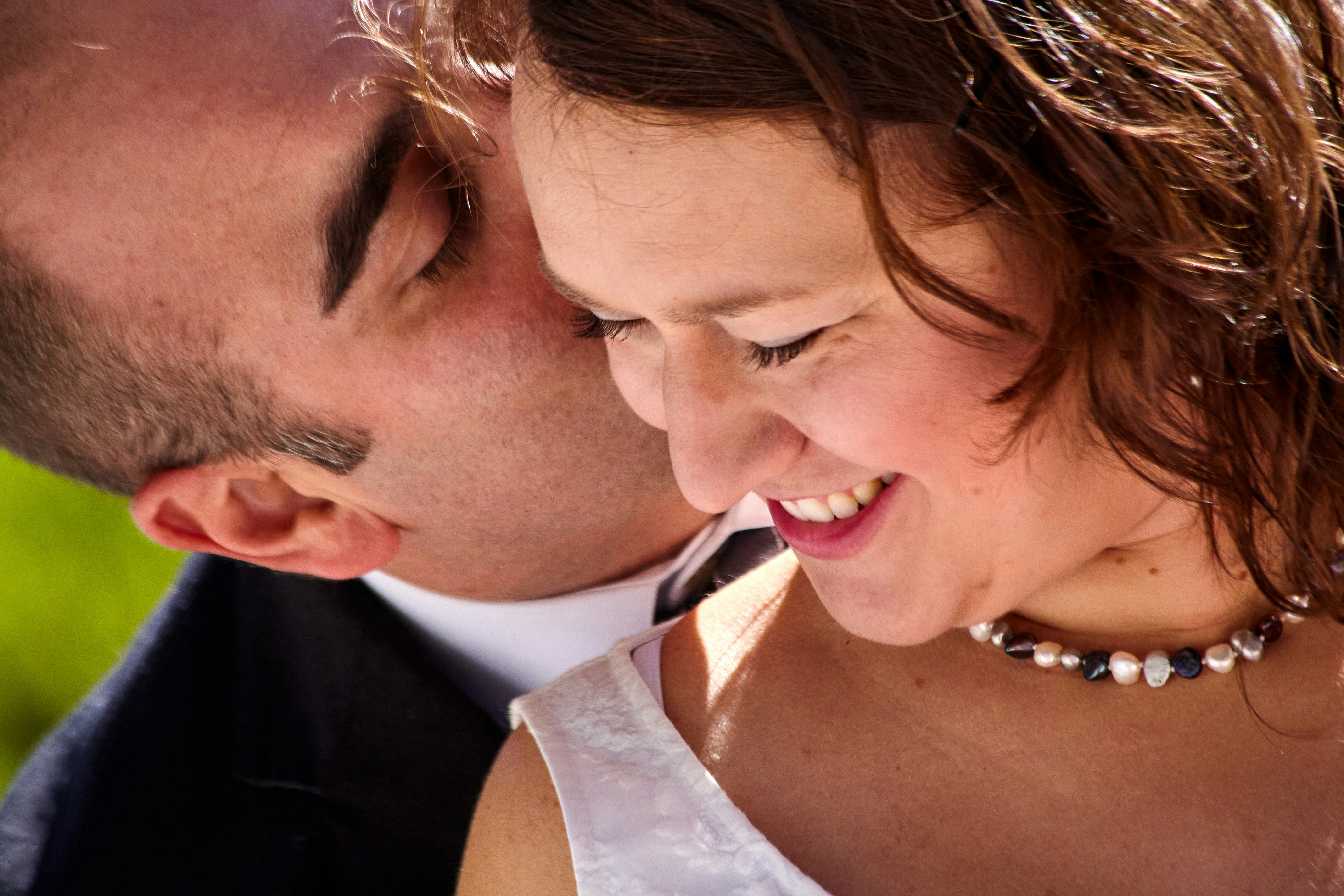 a man and a woman smile at each other