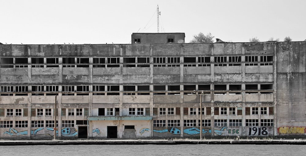 an old building with graffiti on the side of it