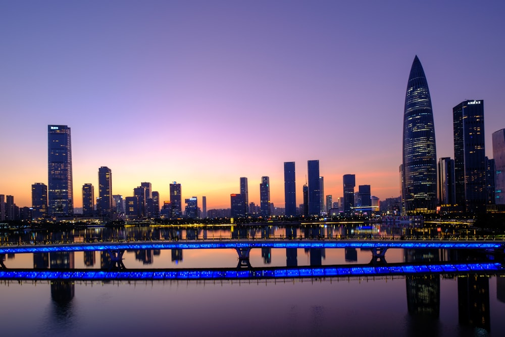 a large body of water with a city in the background