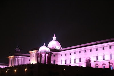 The Suffa Group campus building illuminated at dusk, showcasing its traditional architecture.
