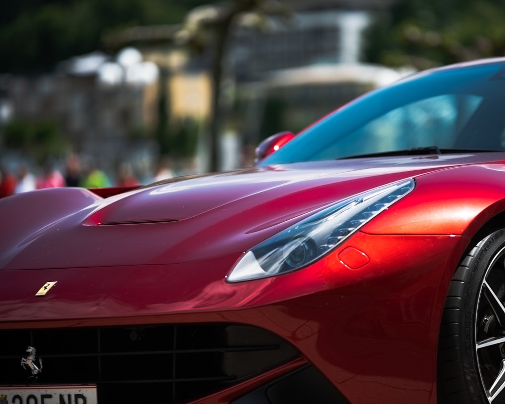 a red sports car parked on the side of the road