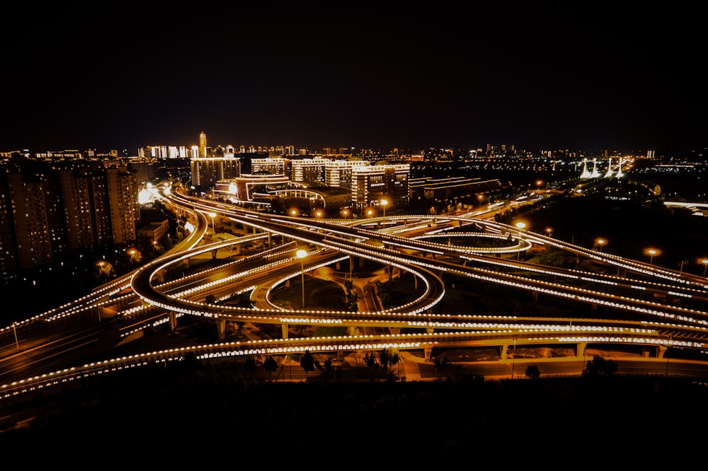 a night time view of a highway intersection