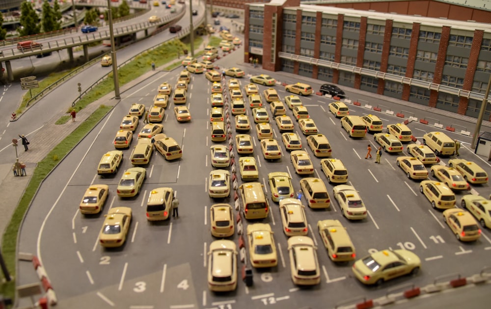 a parking lot filled with lots of yellow cars