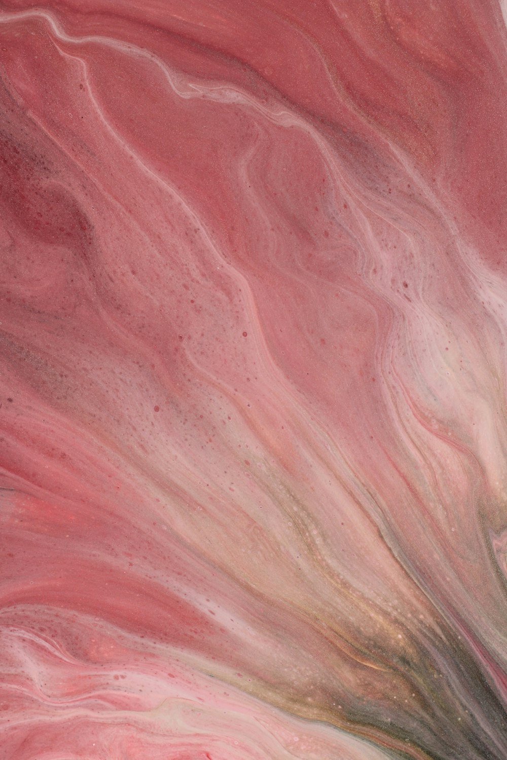 a close up of a pink and grey marble