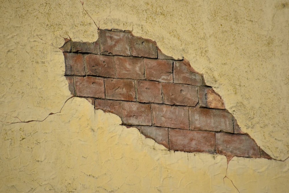 a brick wall with a crack in it