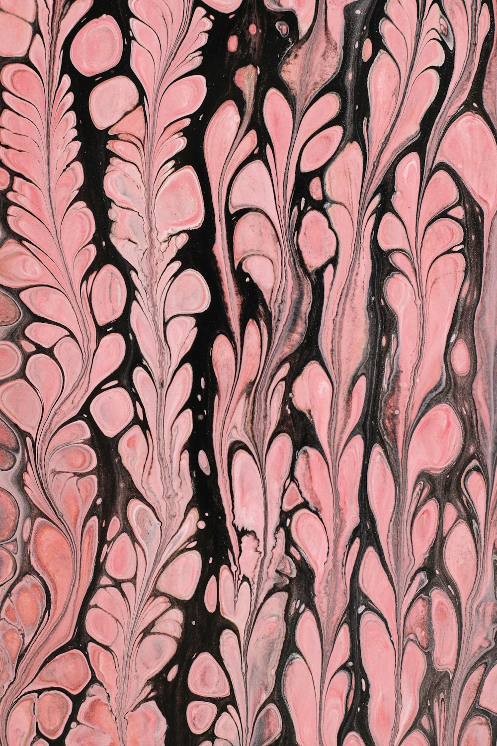 a painting of pink and black leaves on a white background