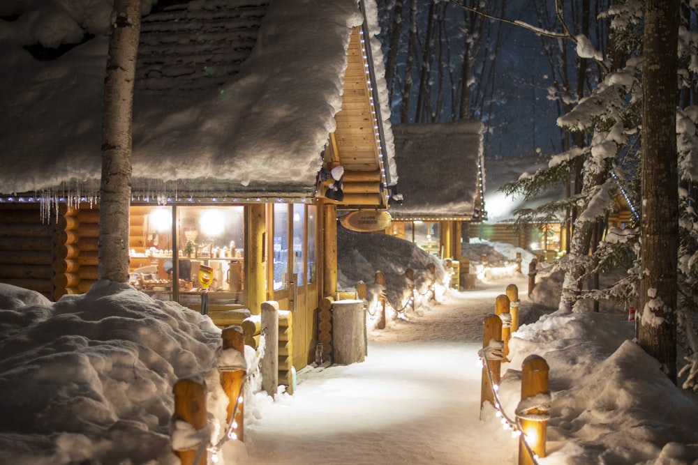 a snow covered street lined with lots of snow