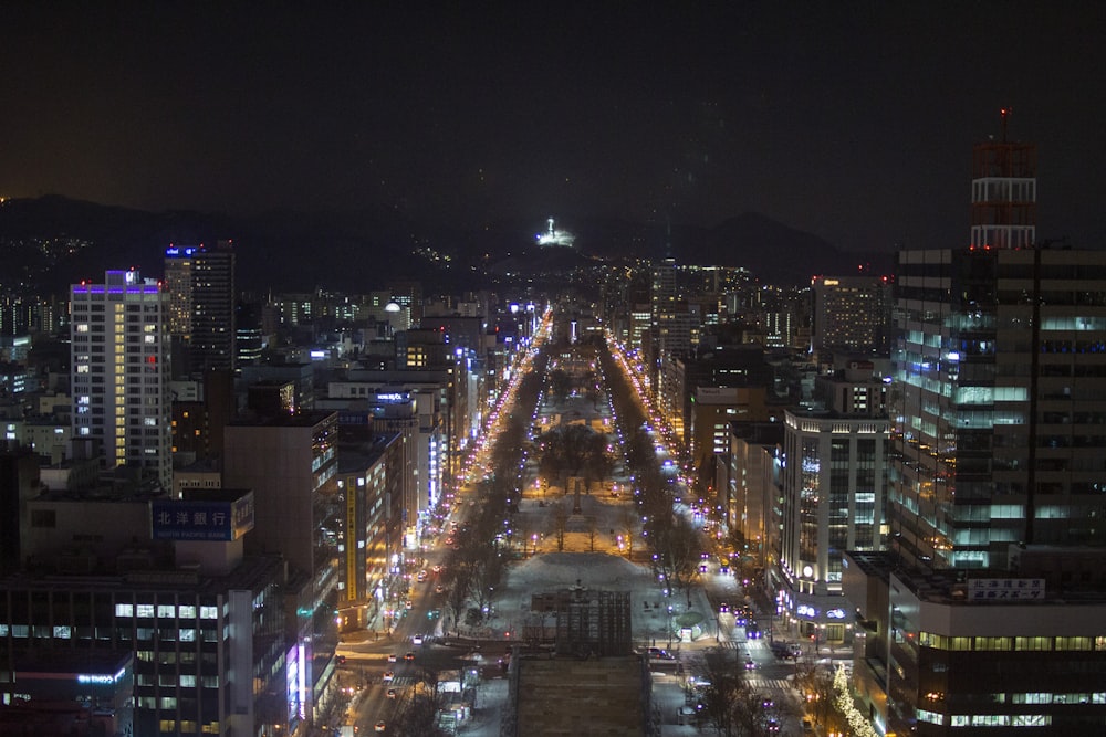 a view of a city at night from the top of a building