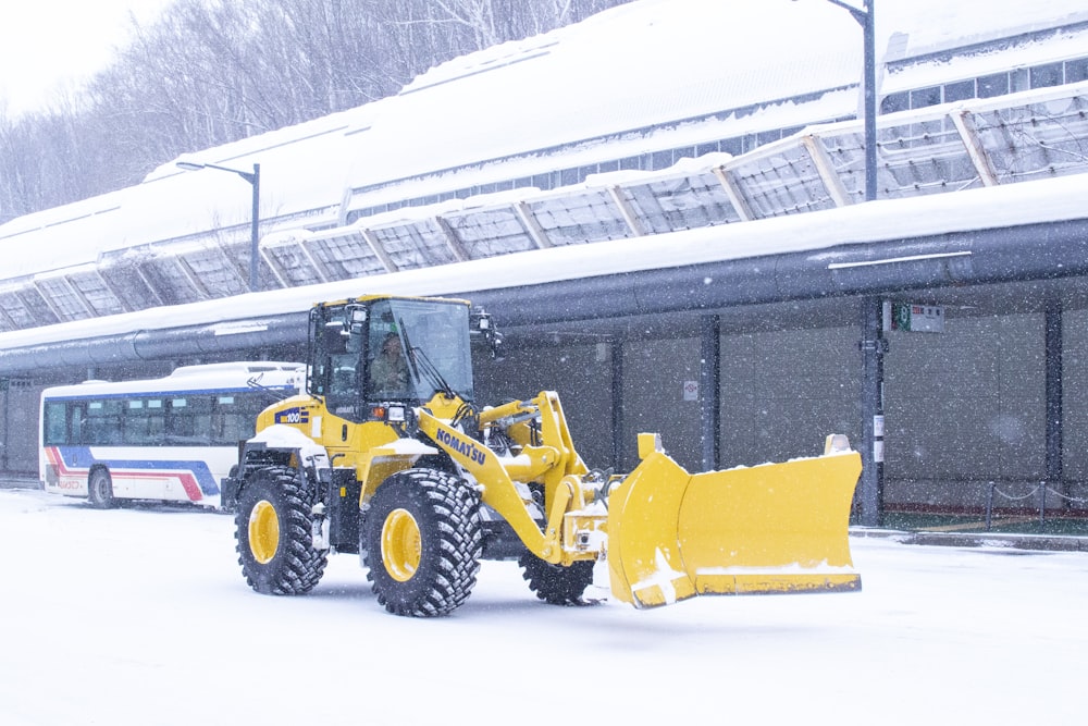 a tractor is parked in front of a train station