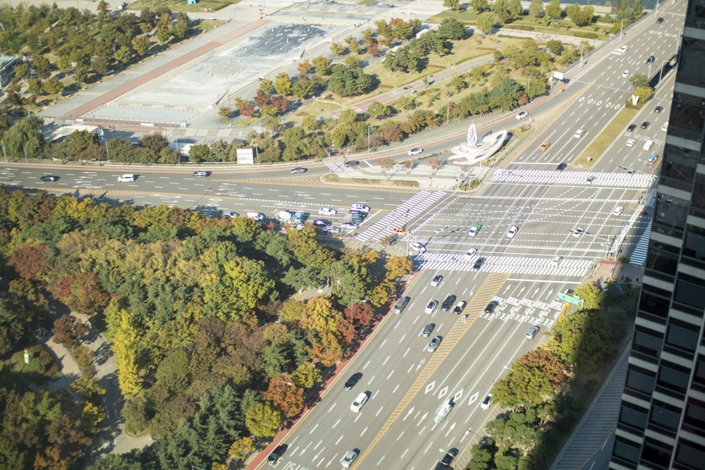 an aerial view of a city street and parking lot