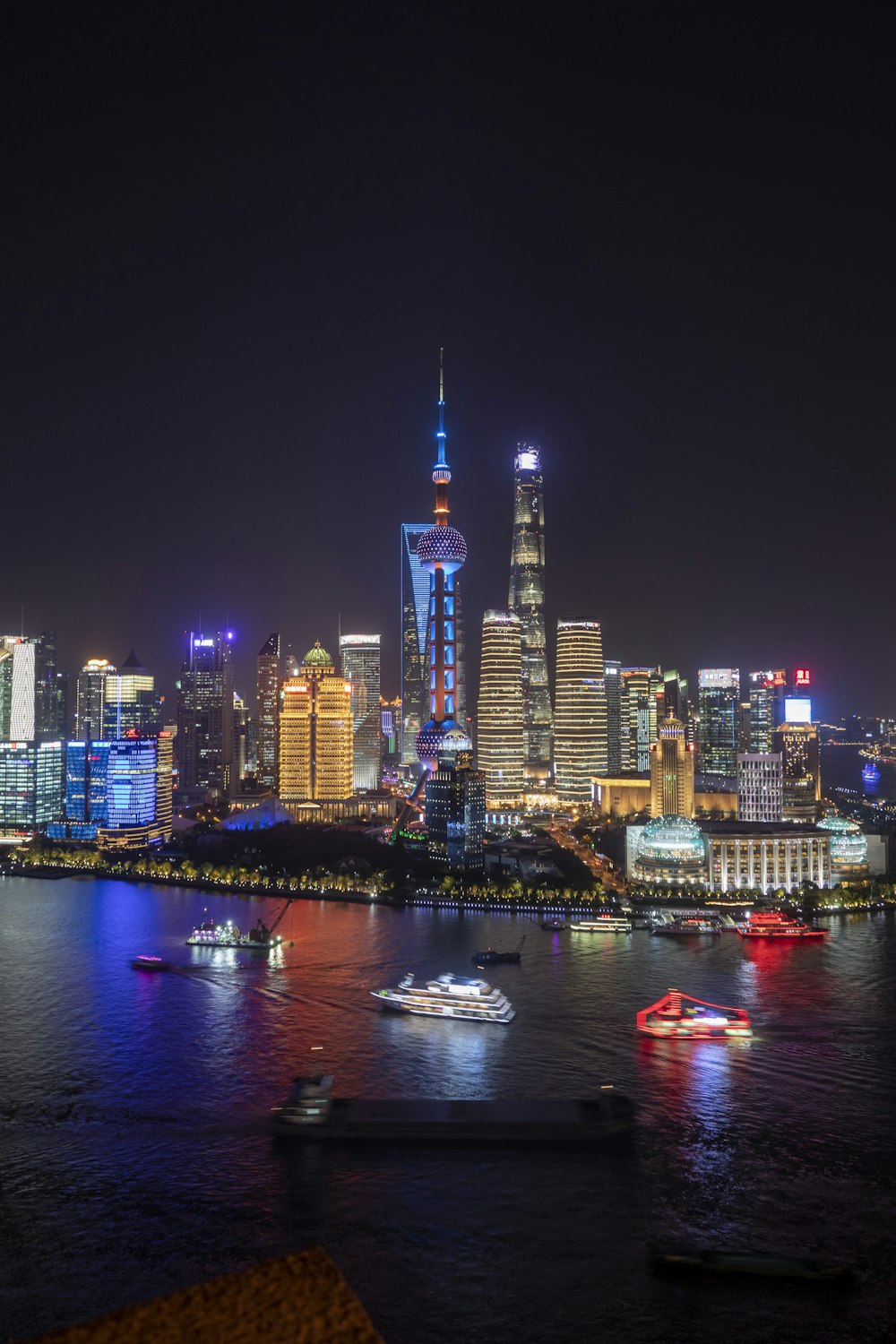 a view of a city at night from across the water