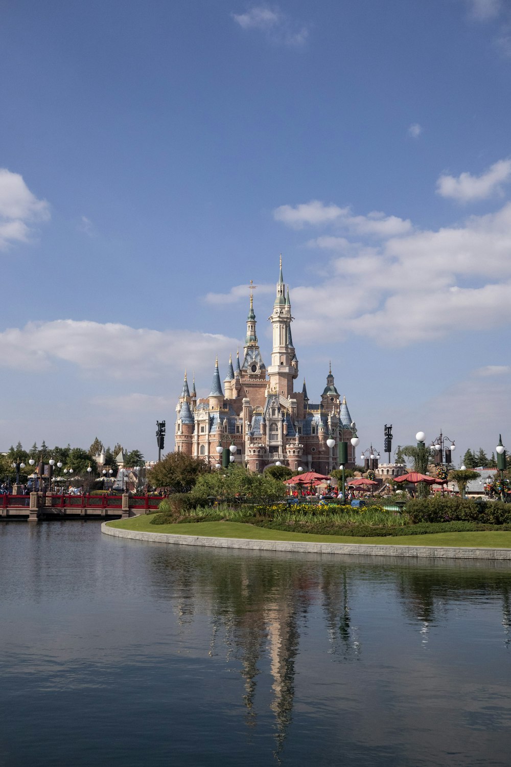 a large castle sitting on top of a lush green field