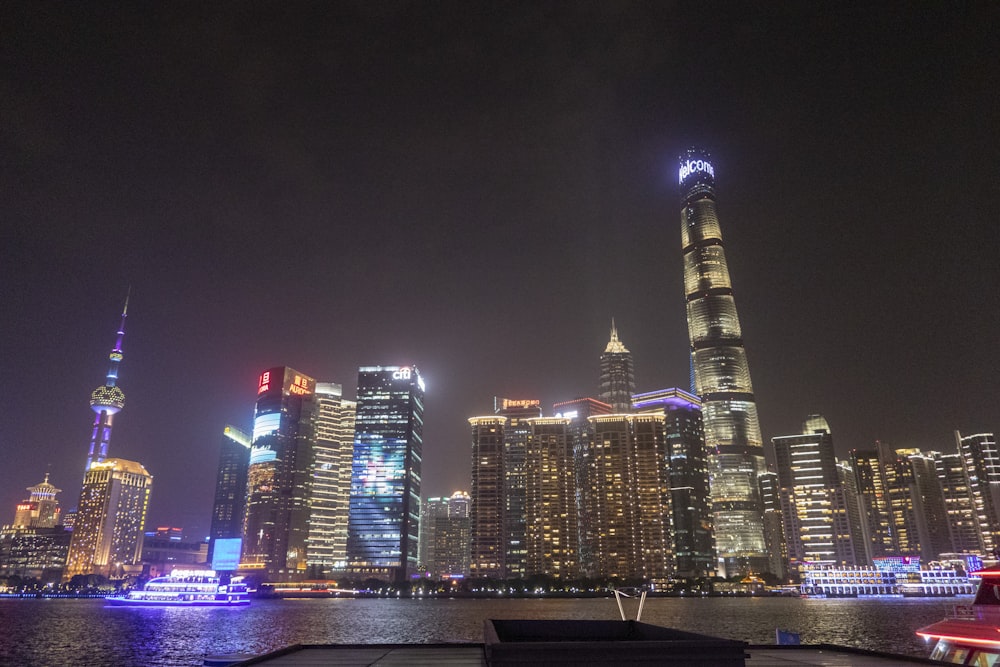 a view of a city at night from the water