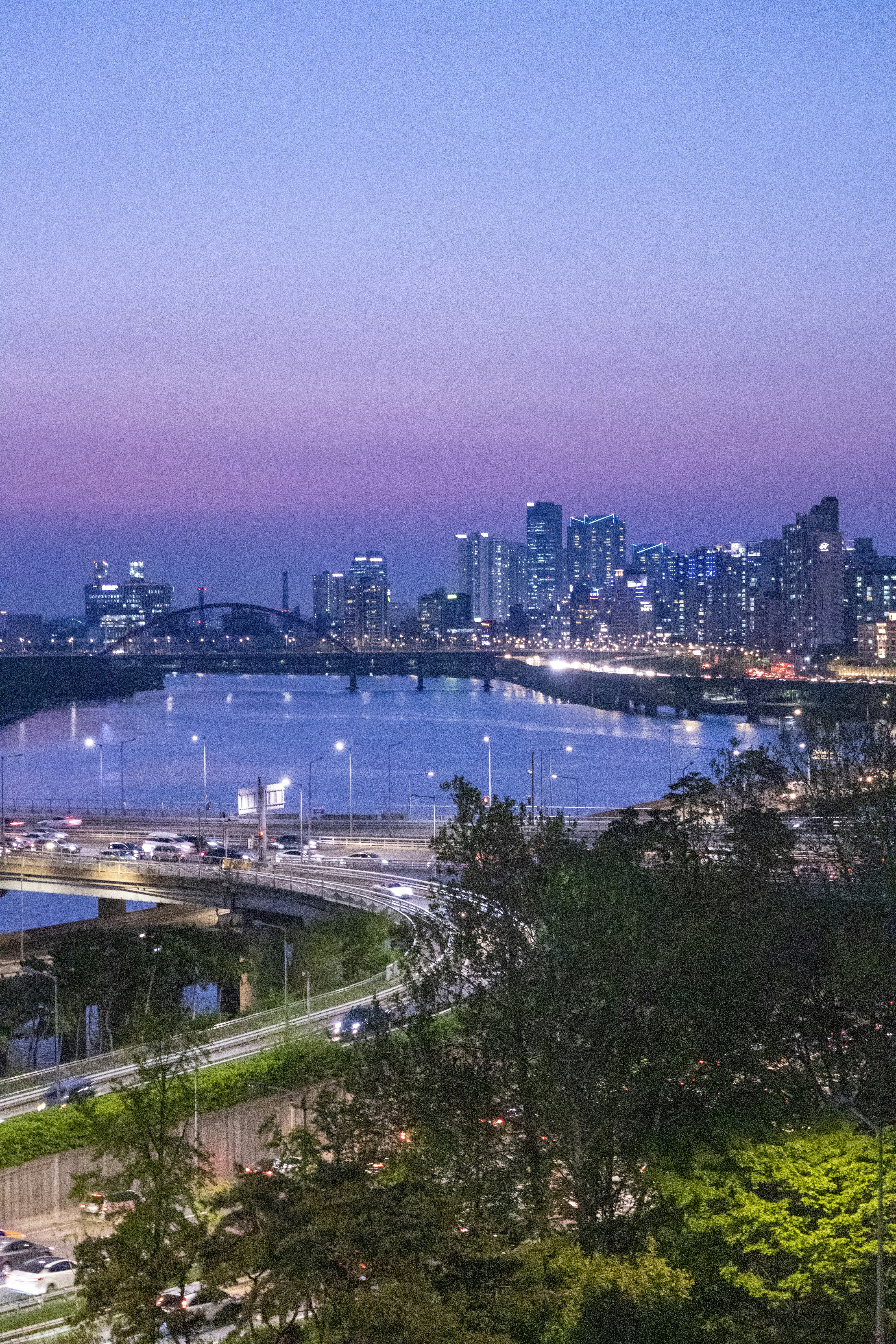 a view of a city and a river at night