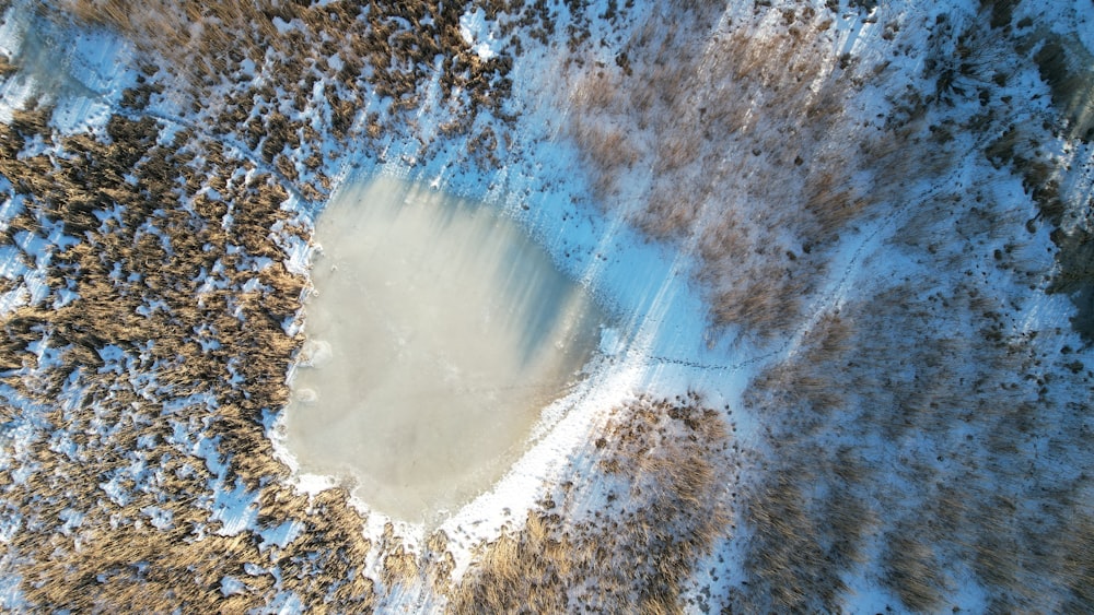 an aerial view of a snow covered area