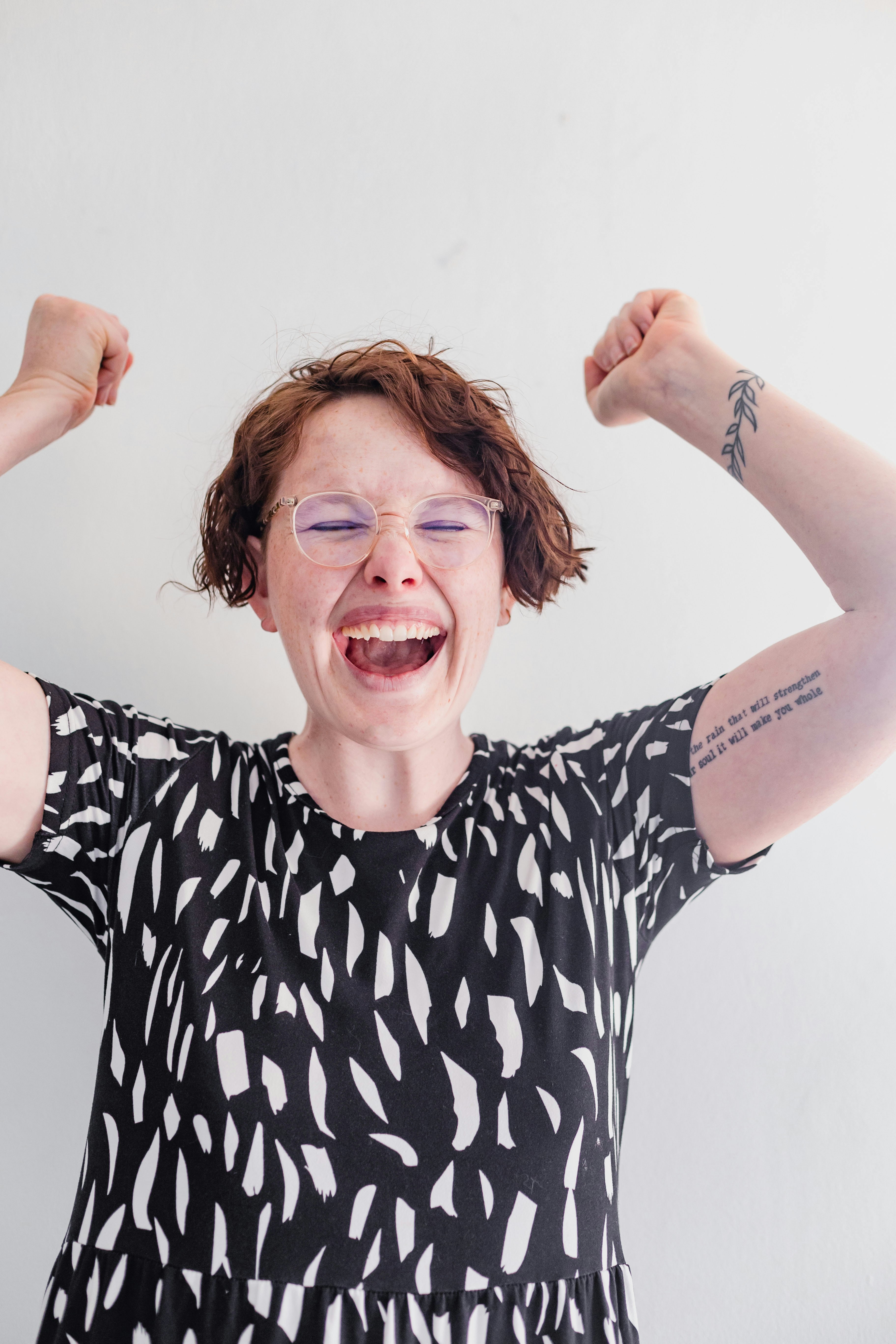 a woman with her arms in the air