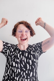 a woman with her arms in the air