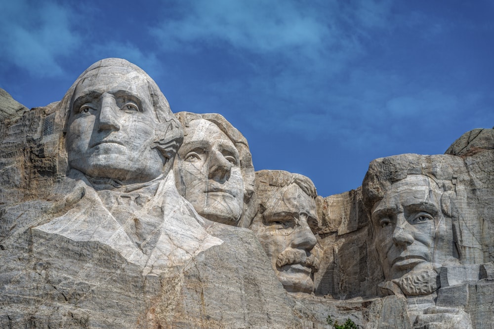 a group of presidents carved into the side of a mountain