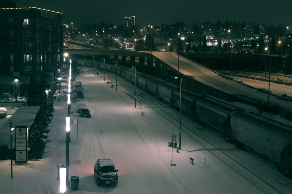 a train traveling down train tracks next to a train station