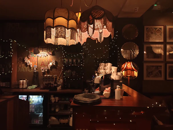 A cozy Italian coffee shop interior with warm lighting and vintage decor.