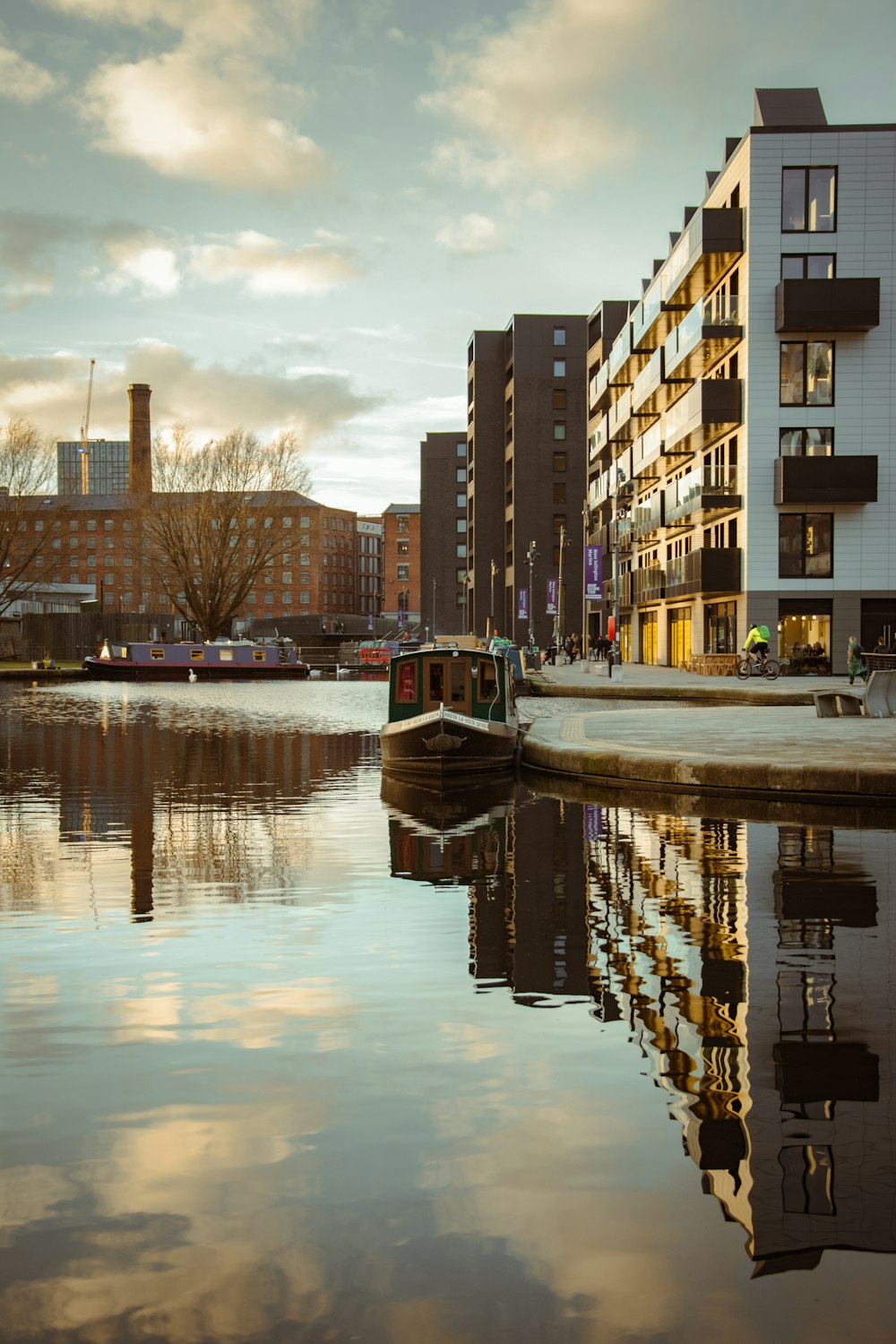 a body of water with buildings in the background