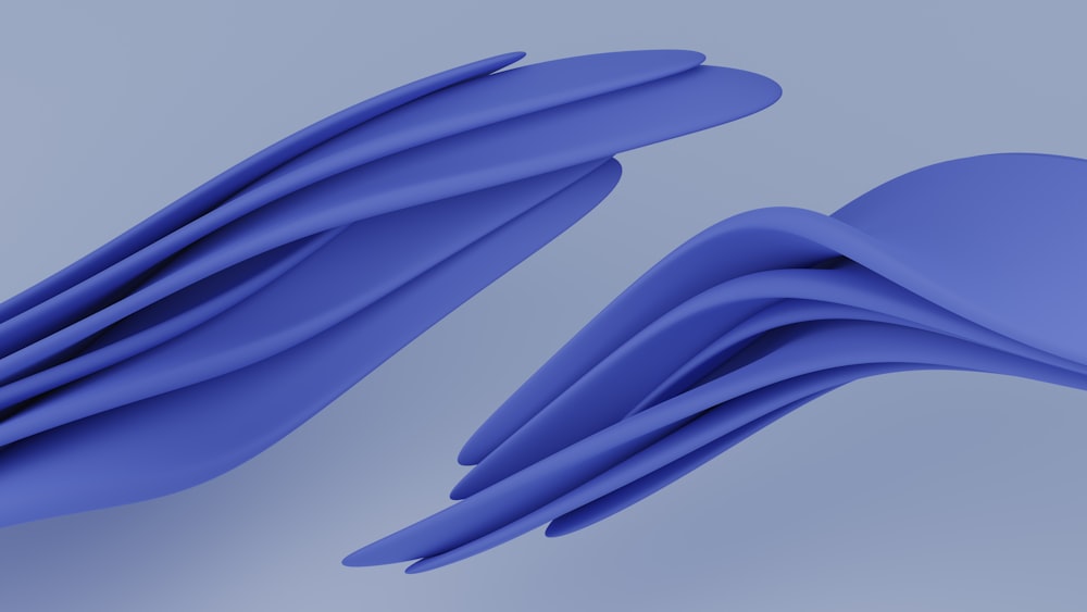 um close up de um objeto azul em um plano de fundo cinza