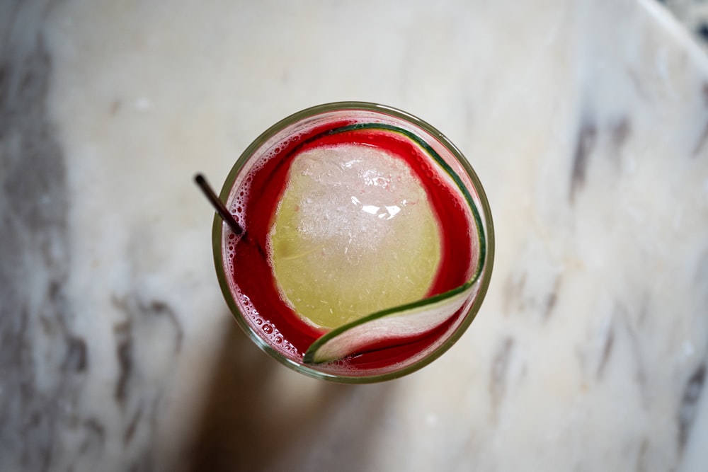 a close up of a drink in a glass on a table