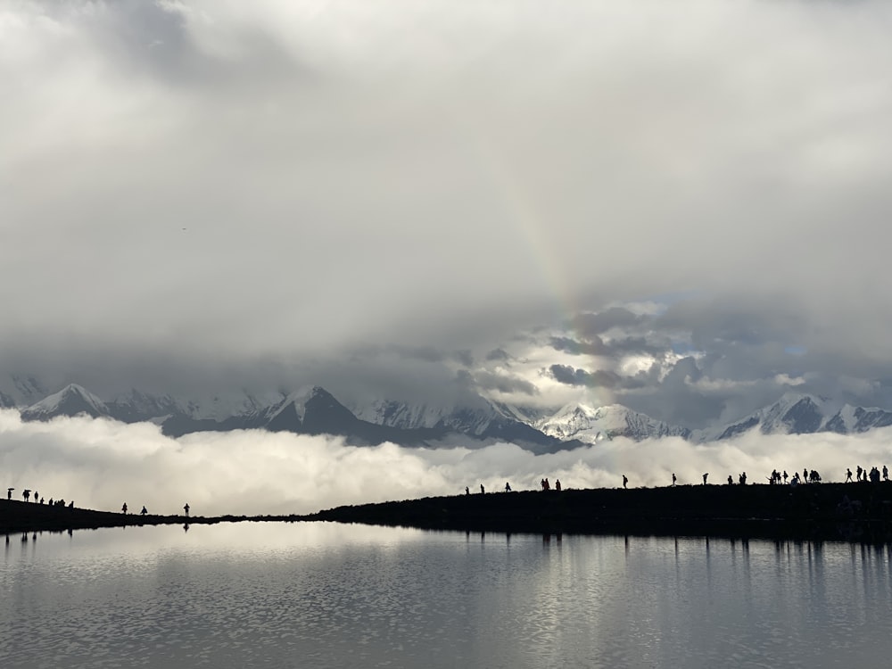 a lake with a rainbow in the middle of it