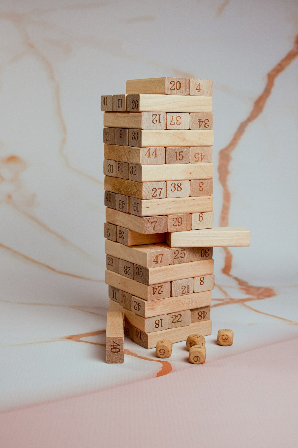 a stack of wooden blocks with numbers on them