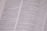 A page from a dictionary is open, displaying text in French with definitions related to photography. The text is in black and white, and the focus is on the central column with parts of the surrounding text slightly out of focus.