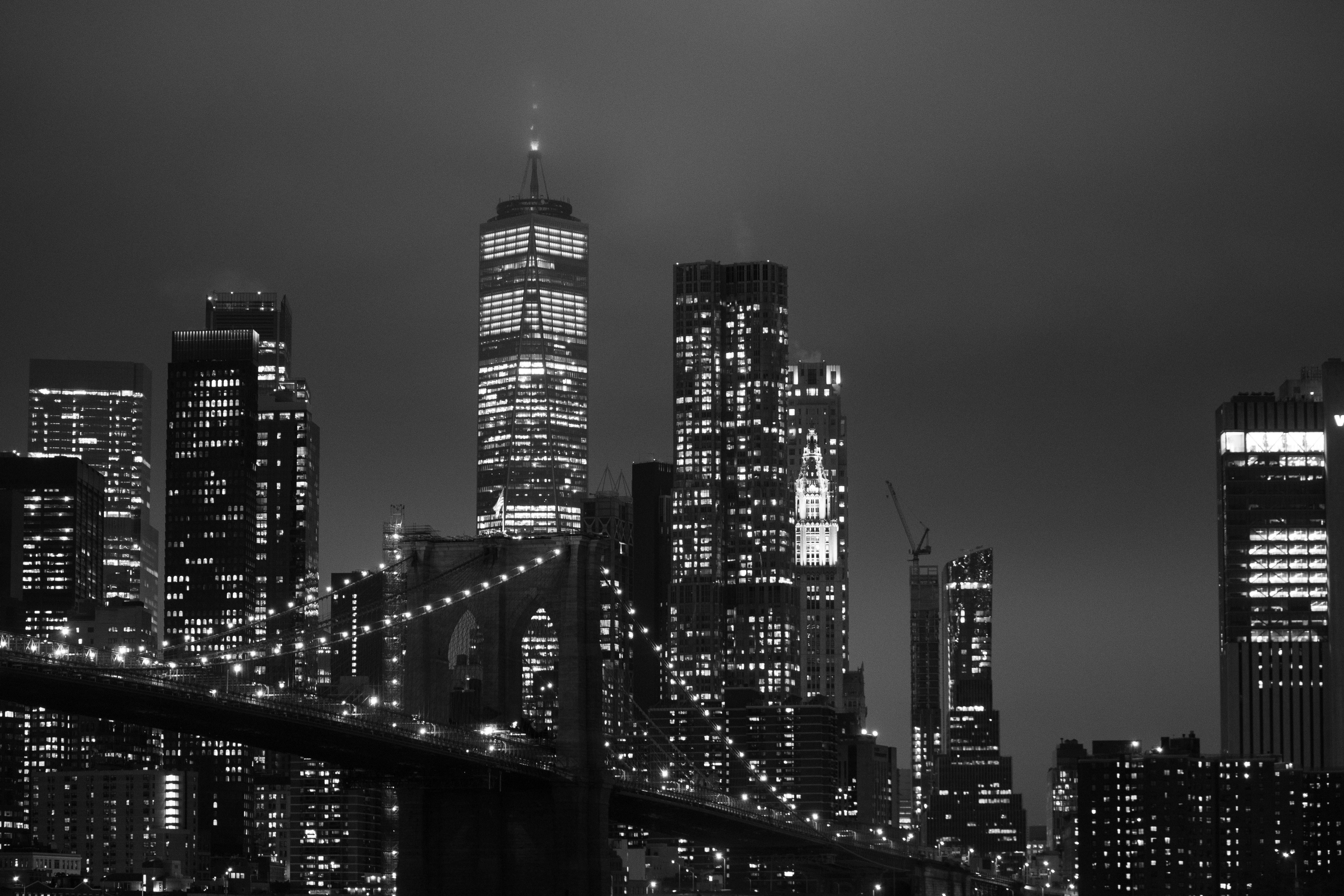 a black and white photo of a city at night
