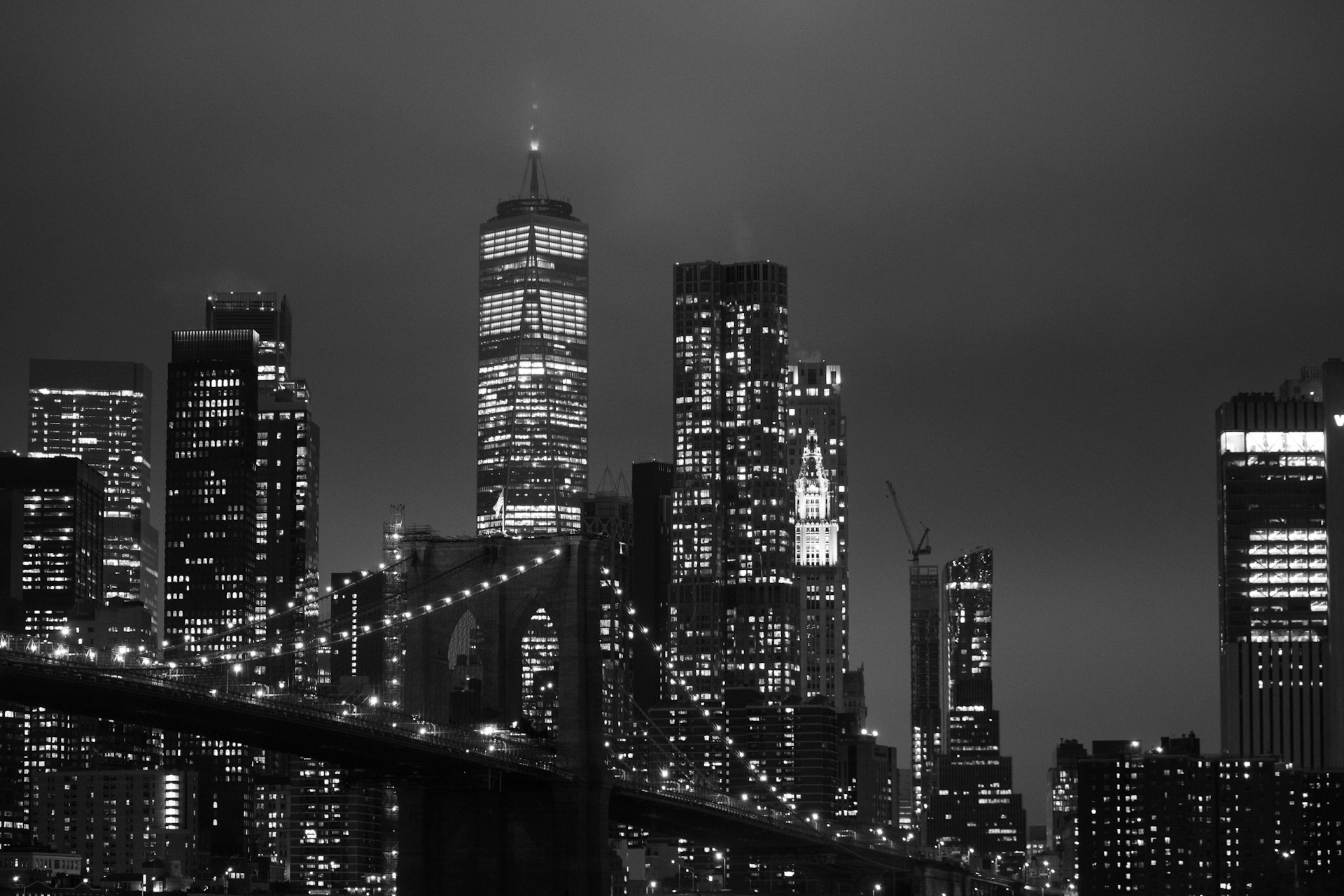 a black and white photo of a city at night