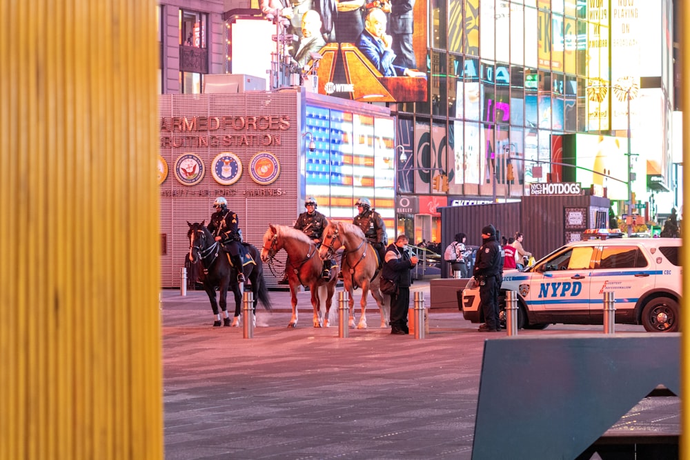 a group of police officers riding on the backs of horses