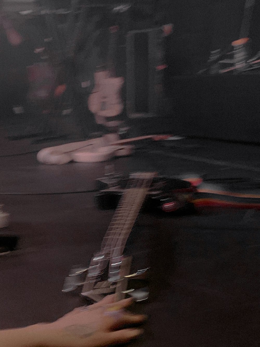 a person playing a guitar on a stage