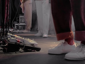 Close-up of feet in motion on stage during a dynamic choreography session