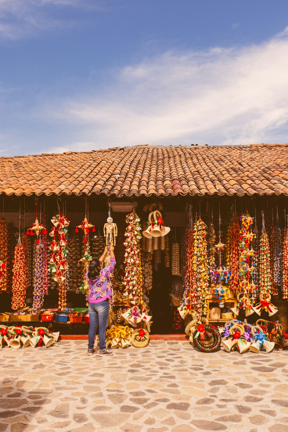 a woman is standing in front of a store