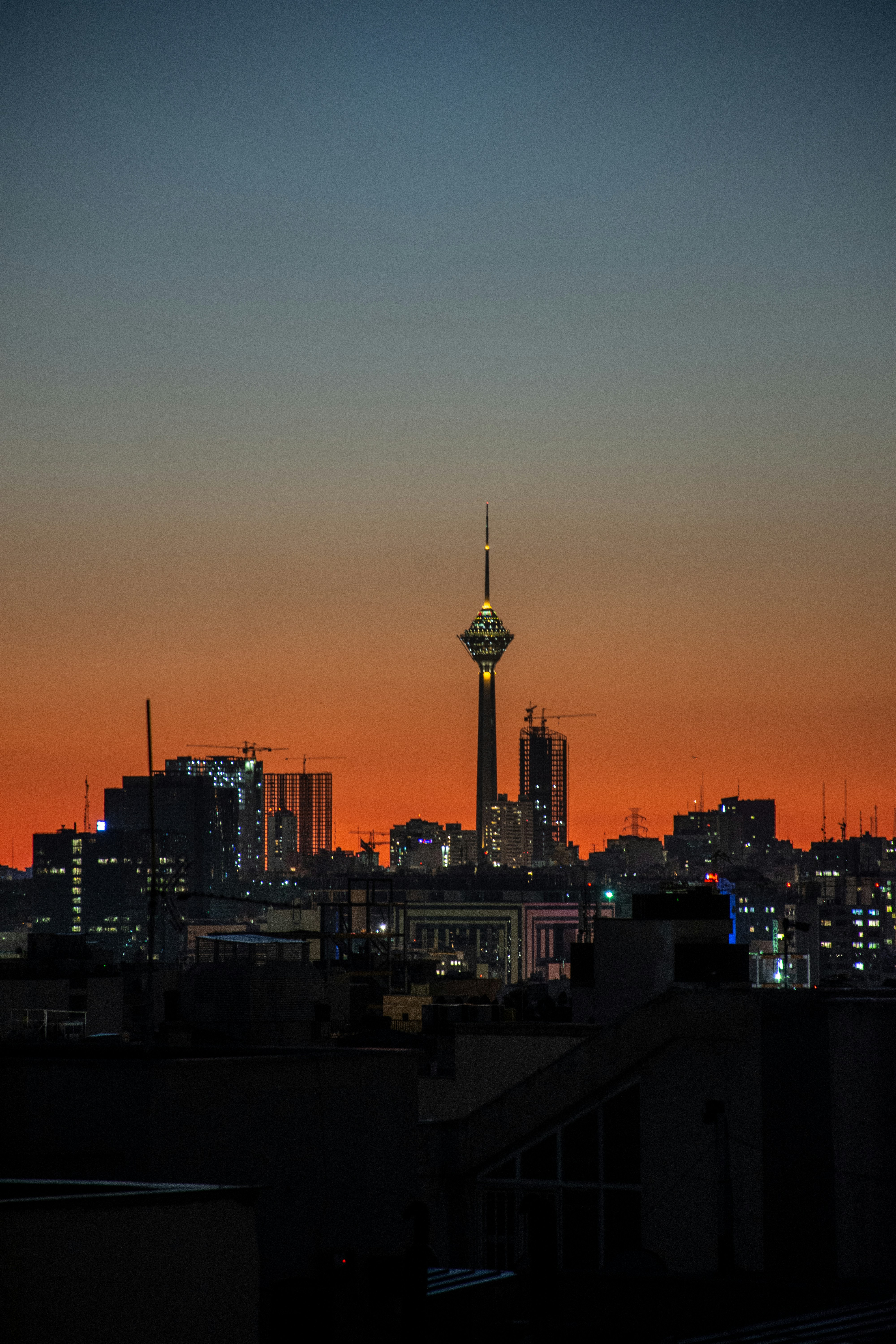 a view of a city skyline at sunset