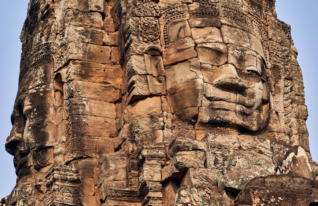 a face carved into the side of a building,