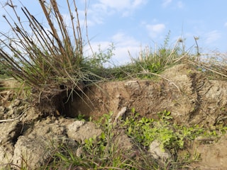 Close-up of Lidar equipment scanning uneven terrain.