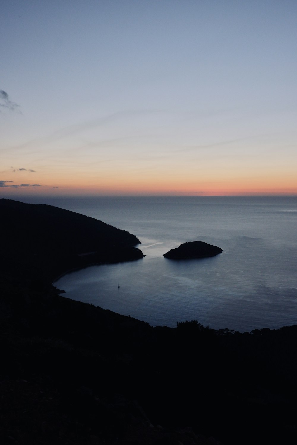 a view of a body of water at sunset