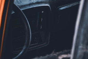 Interior of a vehicle showing used dashboard parts.