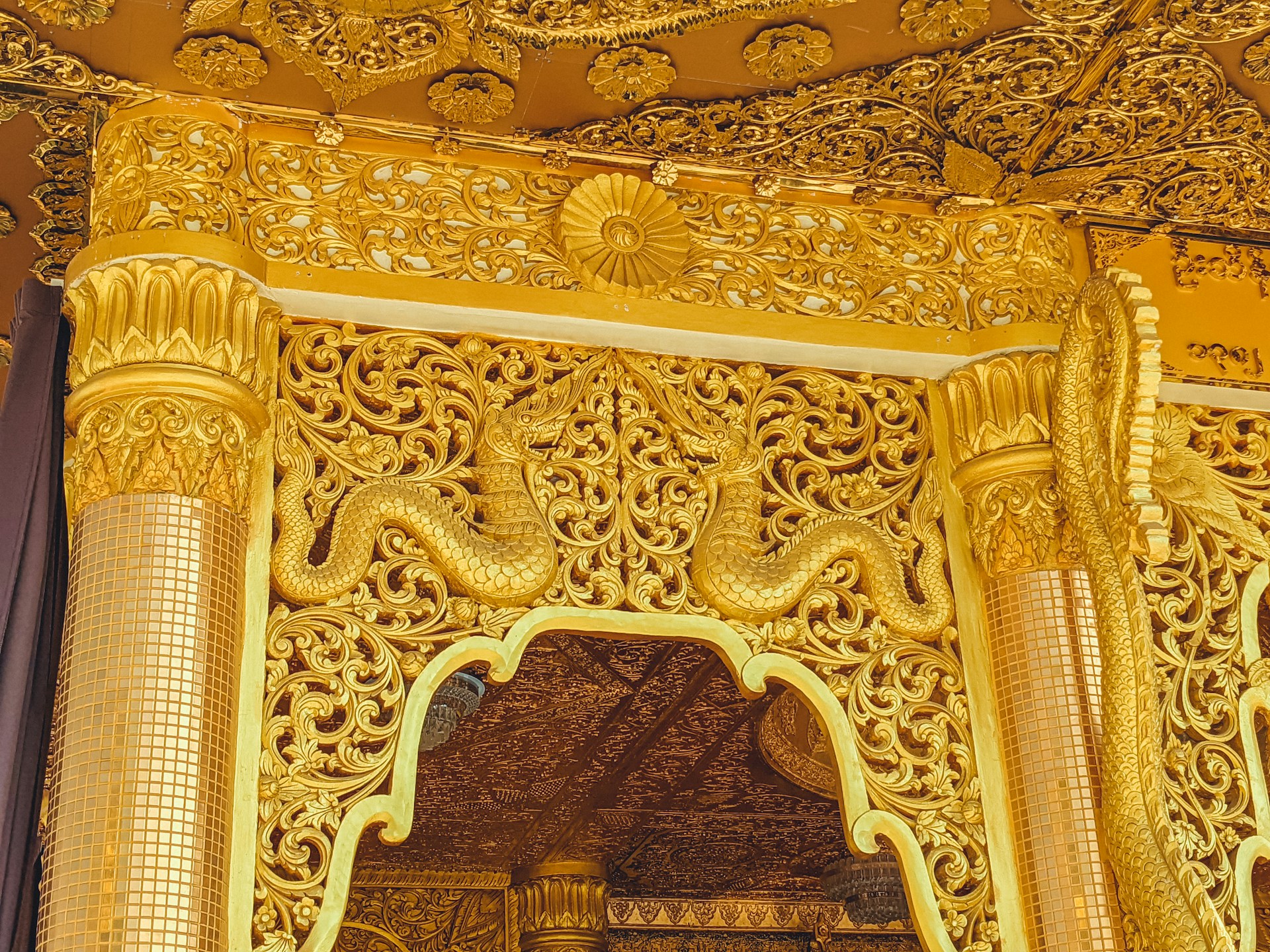 a gold colored building with intricate carvings on it