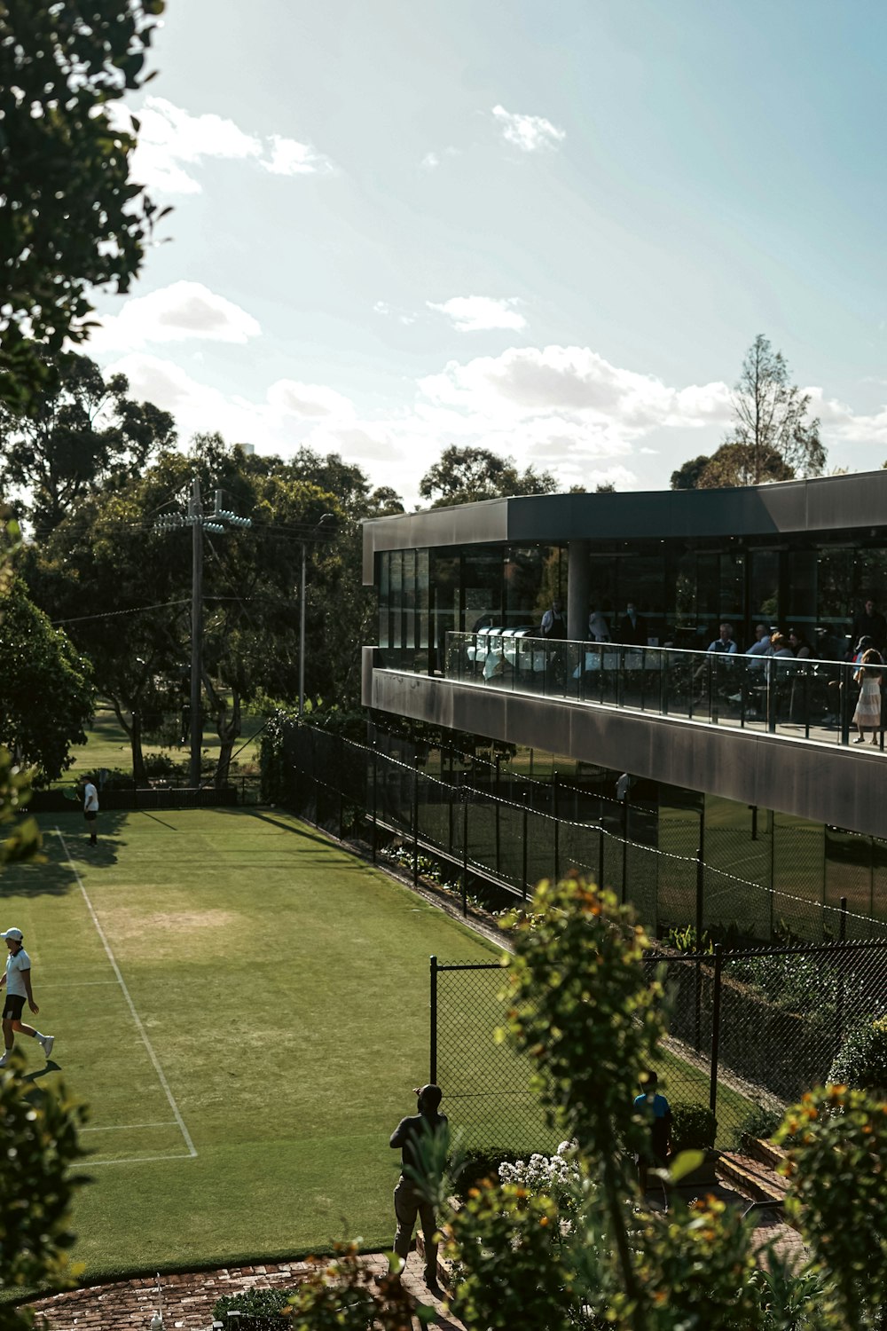 a group of people playing a game of tennis