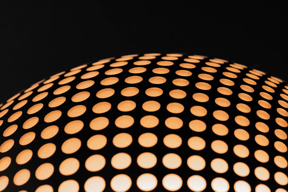 a close up of a lamp with a black background