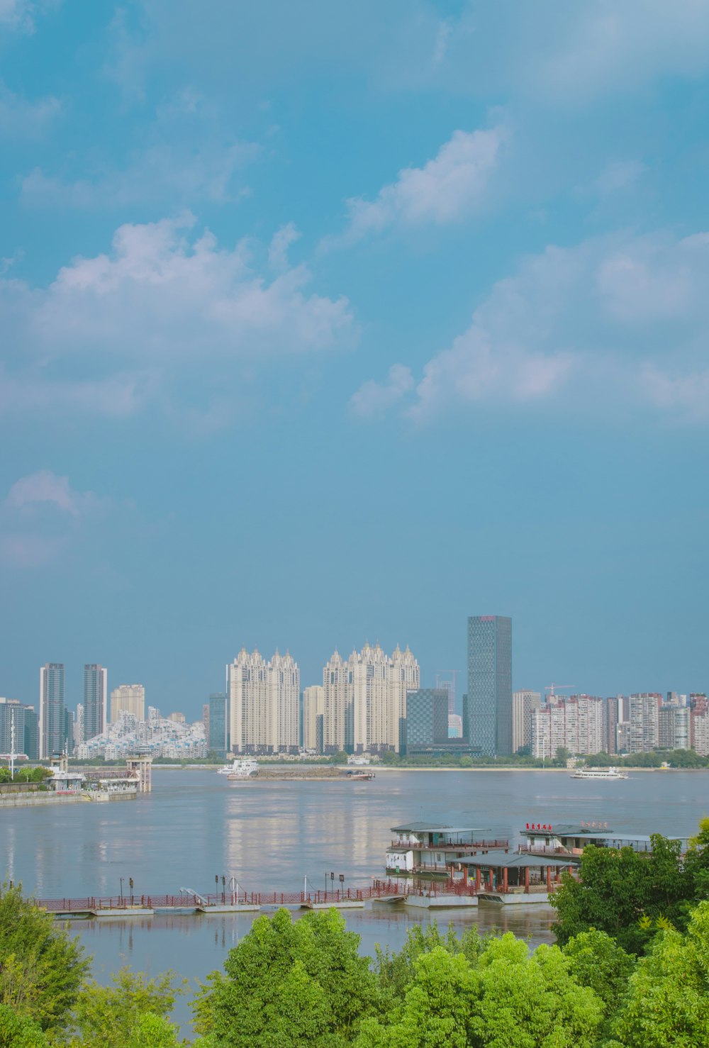 a large body of water with a city in the background