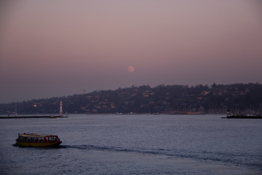 a boat traveling across a large body of water